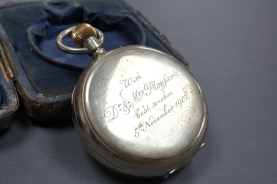 An Edwardian silver mounted travelling watch case, by William Comyns, London, 1903, width 10.2cm, containing a chrome cased pocket watch retailed by Wilson & Sharp.